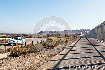 U.S. Border Patrol Vehicle Patrolling Near San Diego/Tijuana Border Wall Editorial Stock Photo