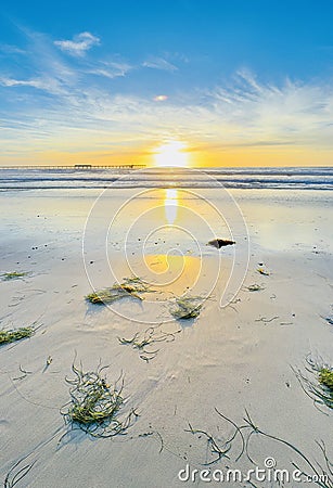 San Diego Golden Sunset: Radiating Sun, Pier Silhouette, and Seaside Serenity Stock Photo