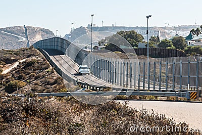 San Diego-Tijuana International Border Wall and Border Patrol Vehicle Stock Photo