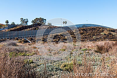 San Diego/Tijuana International Border Wall on Hillside in San Diego Stock Photo