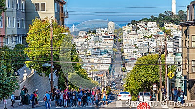 SAN FRANCISCO - AUGUST 7TH, 2017 - Tourists in Lombar Street. It is claimed as the most crooked street in the world, located along Editorial Stock Photo