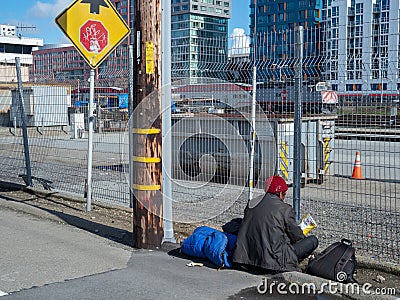 Homeless man rests outside of Caltrain station in San Francisco Editorial Stock Photo