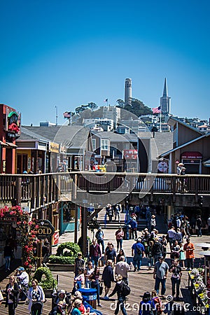 Pier 39 view from above, looking below at the tourists shopping at the gift shops and Editorial Stock Photo