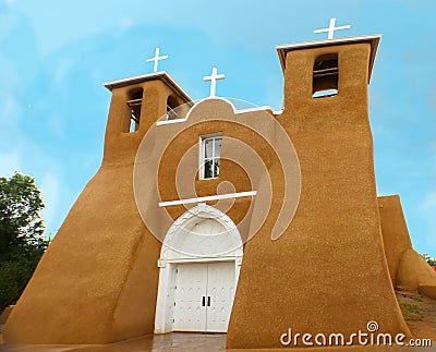 San Francisco de Asis Mission Church in rain - unique adobe architecture located in Taos New Mexico Stock Photo