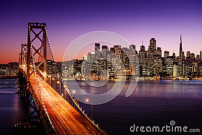 San Francisco skyline and Bay Bridge at sunset, California Stock Photo