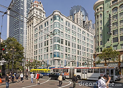 people downtown San Francisco with overhead bus and streetcar Editorial Stock Photo