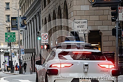 SAN FRANCISO, CALIFORNIA, USA - FEBRUARY 3, 2024: Waymo Self driving taxi car in Downtown San Francisco Editorial Stock Photo