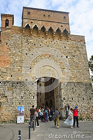 Tourists pass through the San Giovanni gate Editorial Stock Photo