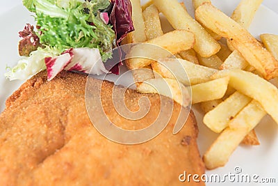 San Jacobo steak filled with cheese with French fries and endive. Stock Photo