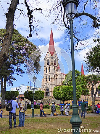 Cathedral and people standing in park Editorial Stock Photo