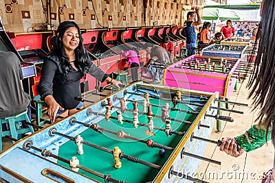 Locals play table football at Guatemalan village fair Editorial Stock Photo