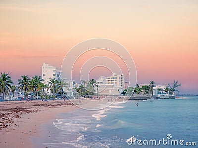 San Juan, Puerto Rico. January 2021. People is resting on San Juan`s Ocean Park Beach after a day`s work just before sunset Editorial Stock Photo