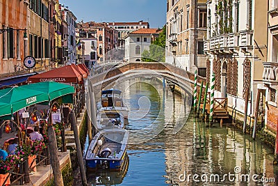 San Lorenzo channel with bridge and pizzeria, Venice Editorial Stock Photo