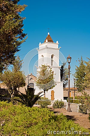 San Lucas church tower built in 1740 in the main square of the village named Toconao in an oasis at the Salar de Atacama, Atacama Stock Photo