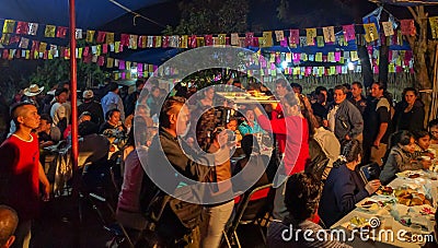 Serving a meal to the community at the Calenda San Pedro in Mexico. Editorial Stock Photo