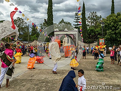 Mojigangas and children dancing at Calenda San Pedro in Oaxaca, Mexico. Editorial Stock Photo