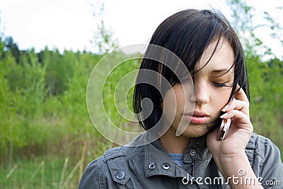 San young girl talking on telephone Stock Photo