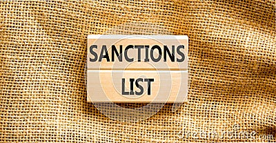 Sanctions list symbol. Wooden blocks with concept words Sanctions list on beautiful canvas background. Business political Stock Photo