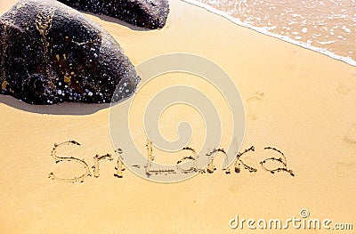 Sand beach of the Indian ocean at Mirissa, Sri Lanka. Hand written words on the beach. Island of Ceylon Stock Photo