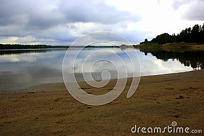 Sand beach and the water reflection Stock Photo