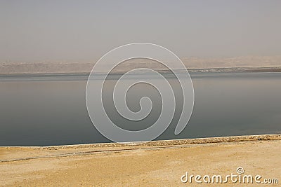 Sand, Dead Sea and mountains in the background, Dead Sea, Jordan Stock Photo