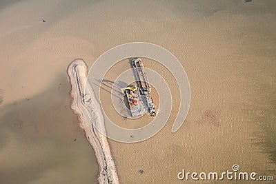 Sand dredger on barge Stock Photo