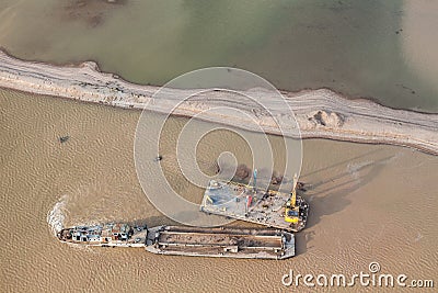 Sand dredger on barge Stock Photo