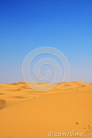 Sand dunes and cloudless blue sky Stock Photo