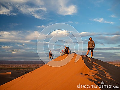 Sand dunes in Morocco, desert landscape, sand texture, tourist camp for night stay, panorama view of sunset over Sahara Editorial Stock Photo