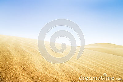 Sand dunes in sunny day. Stock Photo