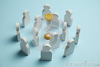 Sand glass clock and figures of employees. Business time Stock Photo