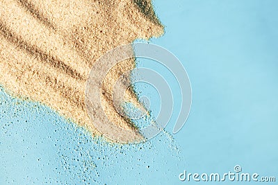 Sand heap texture on blue background. Summer beach surface Stock Photo