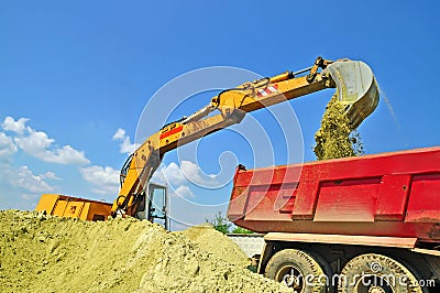 Sand loading in a dump-body truck Stock Photo