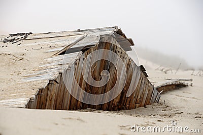 Sand reclaims a building in one of the old mining towns of the Skeleton Coast Stock Photo