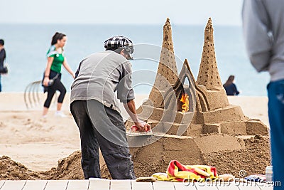 Sand sculptor working at La Barceloneta Beach in Barcelona Spain Editorial Stock Photo