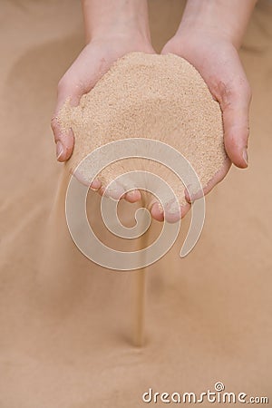 Sand sifting throw hands Stock Photo