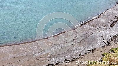 Sand and stones beach east coast of Scotland Stock Photo