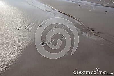 Sand stones on sea waves movie blur Stock Photo