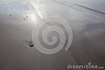 Sand stones on sea waves movie blur Stock Photo