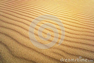 Sand Texture. Brown sand. Background from fine sand. Sand background. yellow dune in the sun. The sun shines on the sand Stock Photo