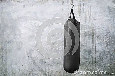 Sandbag hang over with cement background. Stock Photo