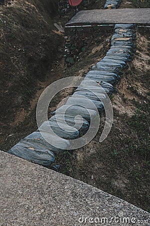 Sandbag for protecting the enemy from invading front line. Sandbag and bunker of the old military bunker base in border area Stock Photo