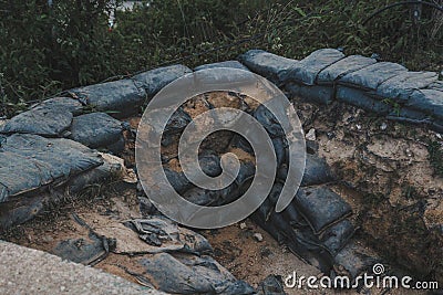 Sandbag for protecting the enemy from invading front line. Sandbag and bunker of the old military bunker base on the mountain Stock Photo