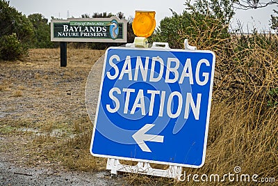 Sandbag Station sign on a rainy day when there is a risk of flooding; Palo Alto, San Francisco bay area, California Stock Photo