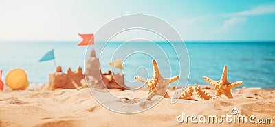 Sandcastle on the beach at sea in summertime Stock Photo