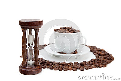 Sandclock and cup of coffee grains Stock Photo