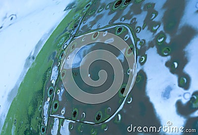 Sanded steel surface with rivets Stock Photo