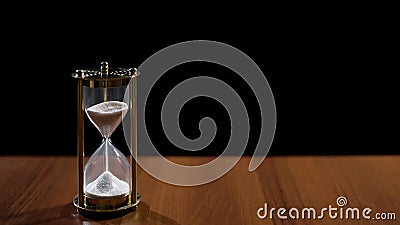 Sandglass measuring time by sand flow, life passing quickly, time management Stock Photo