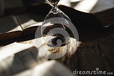 Sandglass on the table concept Stock Photo