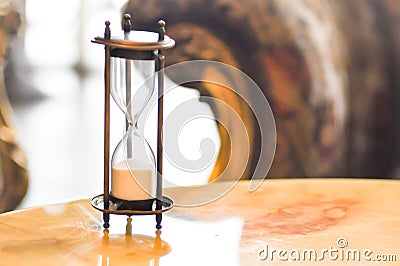 Sandglass on the table Stock Photo